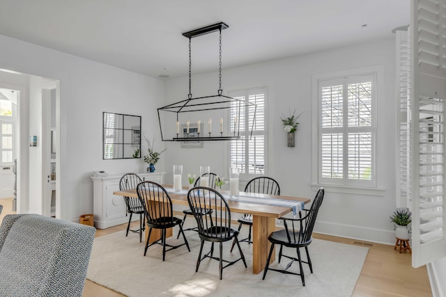 dining room featuring light hardwood / wood-style flooring