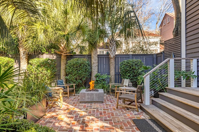 view of patio with a fire pit