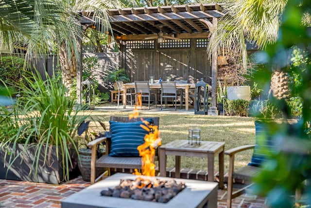 view of patio / terrace featuring an outdoor fire pit