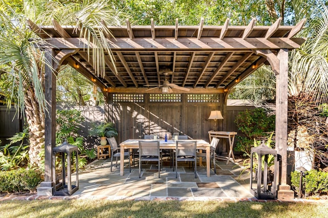 view of patio with ceiling fan and a pergola