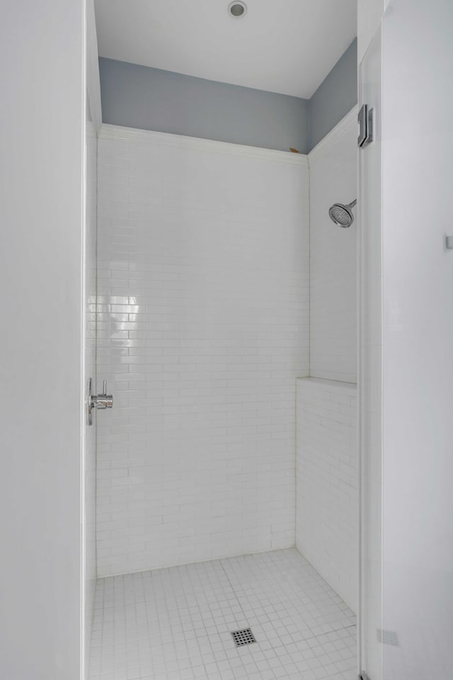 bathroom with tiled shower