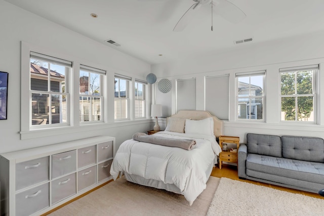 bedroom featuring ceiling fan and light hardwood / wood-style floors