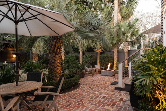 view of patio / terrace featuring a fire pit