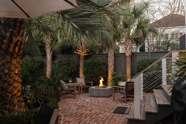 view of patio with a fire pit