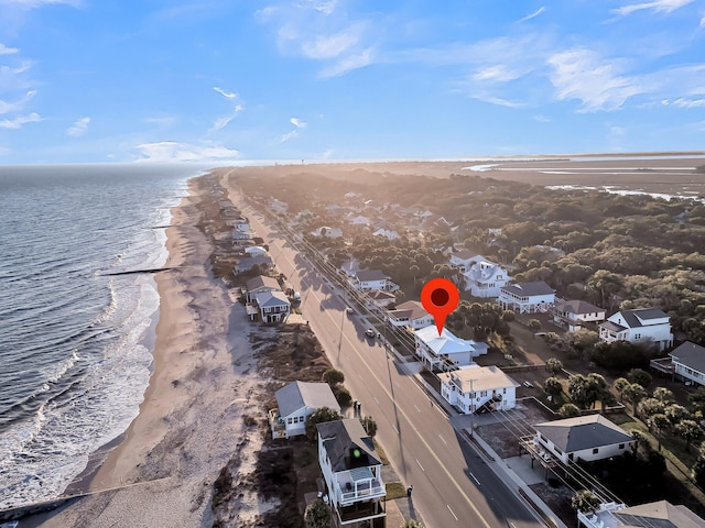 bird's eye view with a water view and a beach view