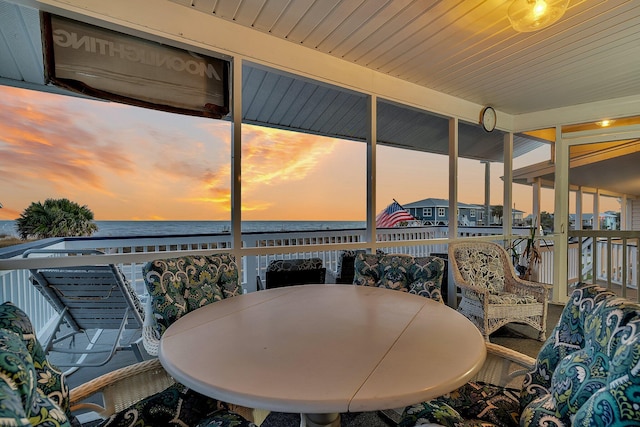 patio terrace at dusk with a water view