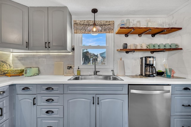 kitchen with sink, hanging light fixtures, stainless steel dishwasher, ornamental molding, and decorative backsplash