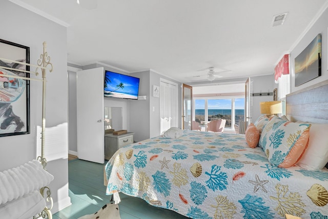 bedroom with crown molding, ceiling fan, access to exterior, and hardwood / wood-style flooring