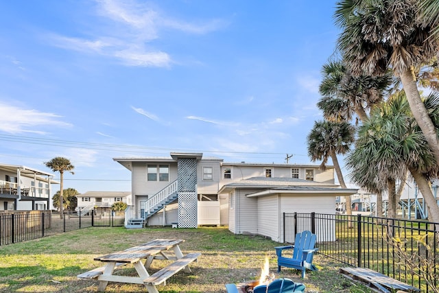 back of property featuring a lawn