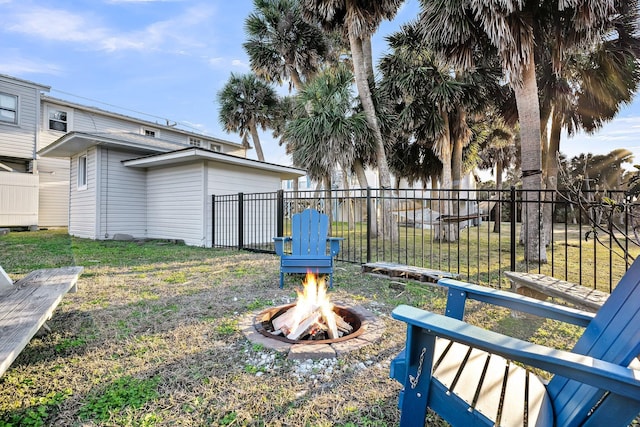 view of yard featuring an outdoor fire pit