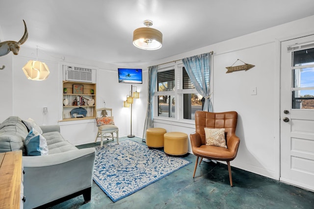 sitting room with an AC wall unit