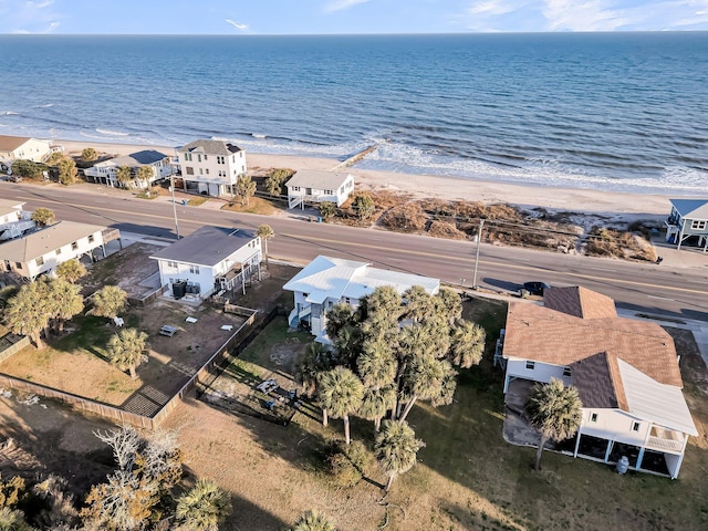 aerial view with a water view and a beach view