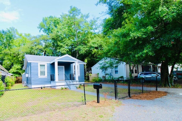 bungalow-style house with a front lawn