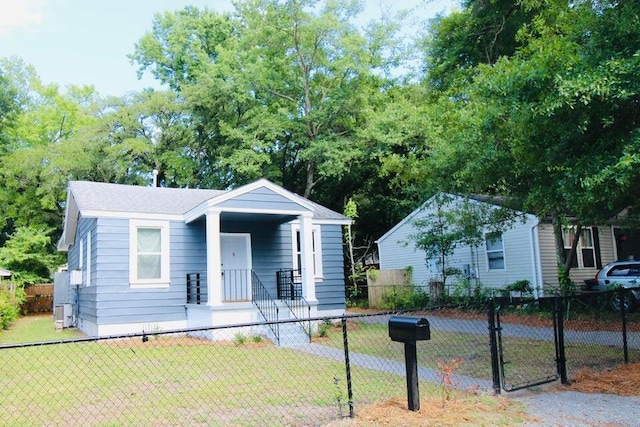 bungalow-style home with a front yard