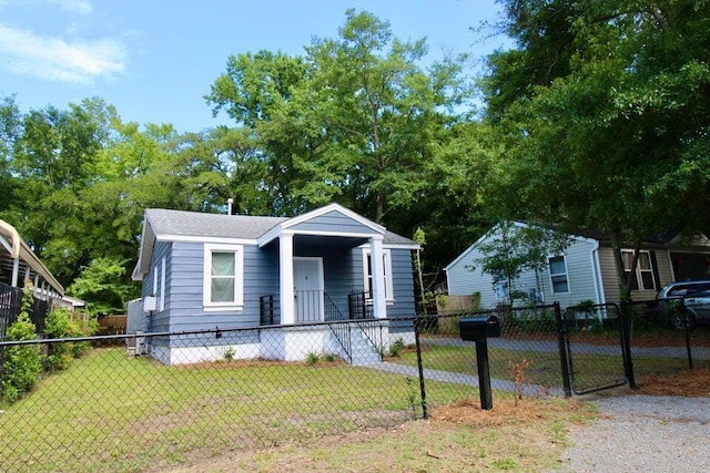 bungalow-style house with a front lawn