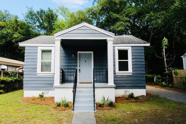 bungalow-style house featuring a front yard