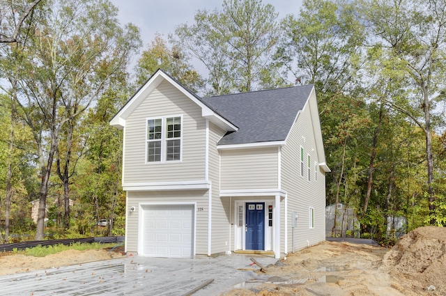 front of property with a garage