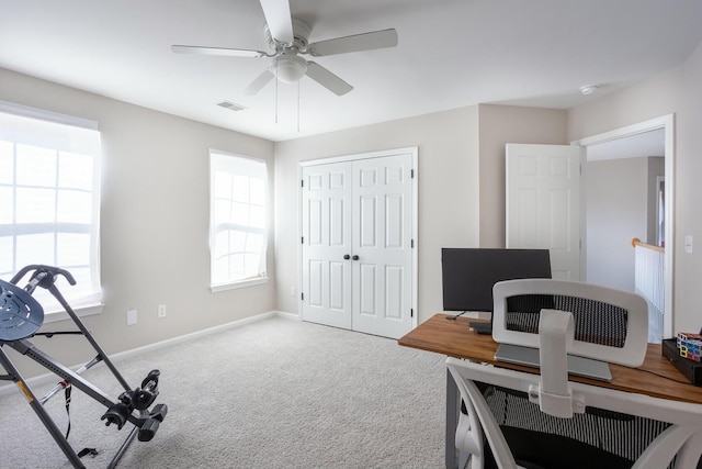 office area with carpet floors and ceiling fan