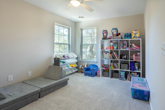 game room with ceiling fan and carpet floors