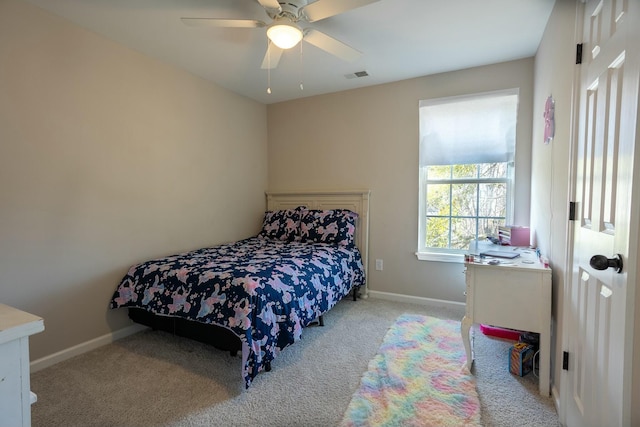 bedroom with light carpet and ceiling fan