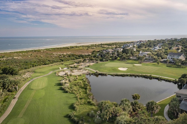 birds eye view of property featuring view of golf course and a water view