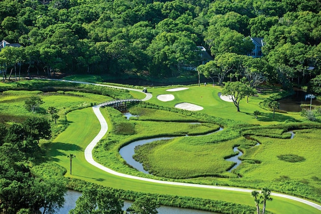 surrounding community with a water view and golf course view