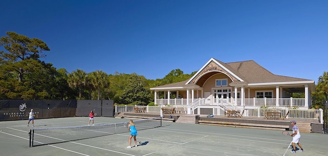 view of sport court featuring fence