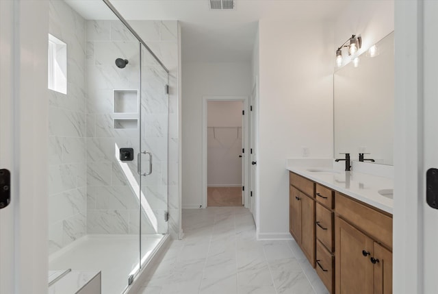 351 Blue Oak Dr, Moncks Corner, SC 29461 - full bathroom with double vanity, a shower stall, marble look tiles, and a walk in closet