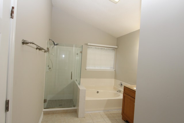 bathroom with vanity, vaulted ceiling, separate shower and tub, and tile patterned flooring