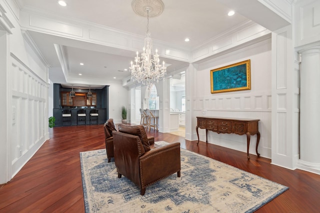 3 Cross Ln, Isle Of Palms, SC 29451 - living area with a chandelier, a decorative wall, wood finished floors, ornamental molding, and recessed lighting