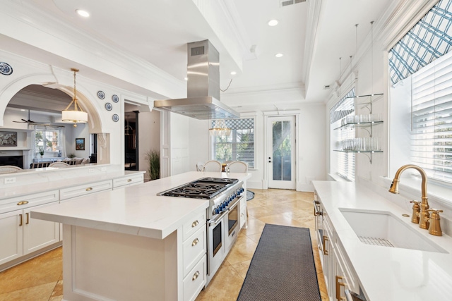 3 Cross Ln, Isle Of Palms, SC 29451 - kitchen with island range hood, a sink, double oven range, a kitchen island, and crown molding