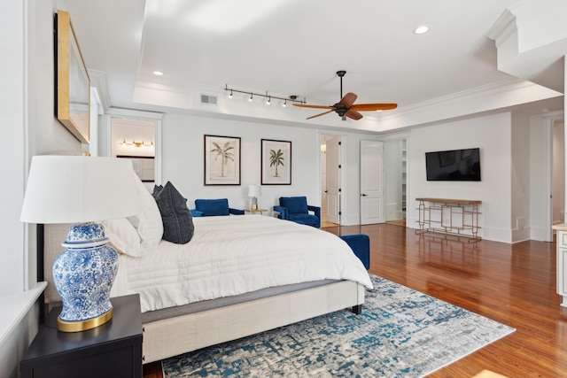 3 Cross Ln, Isle Of Palms, SC 29451 - bedroom with a tray ceiling, wood finished floors, ornamental molding, recessed lighting, and rail lighting