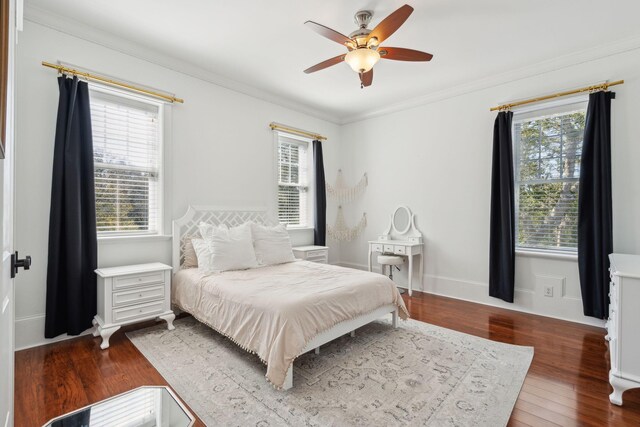 3 Cross Ln, Isle Of Palms, SC 29451 - bedroom featuring multiple windows, wood finished floors, ornamental molding, and a ceiling fan