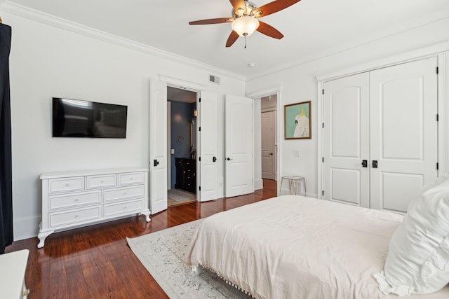 3 Cross Ln, Isle Of Palms, SC 29451 - bedroom with crown molding, dark wood-type flooring, a closet, ceiling fan, and baseboards
