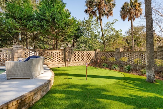 3 Cross Ln, Isle Of Palms, SC 29451 - fenced backyard featuring a putting area