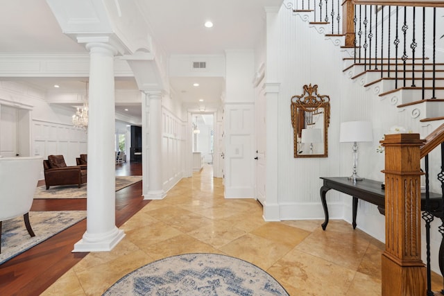 3 Cross Ln, Isle Of Palms, SC 29451 - entryway with ornate columns, stairs, a chandelier, ornamental molding, and recessed lighting