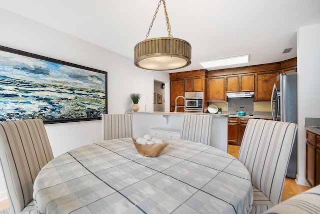 dining room featuring sink