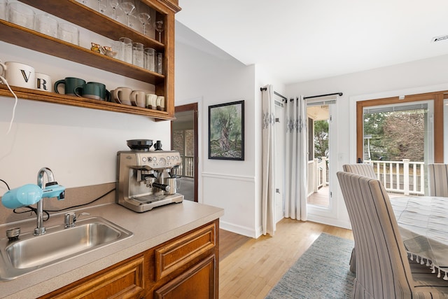 kitchen featuring sink and light wood-type flooring