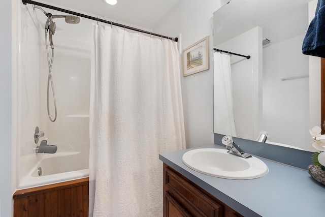 bathroom featuring vanity and shower / tub combo