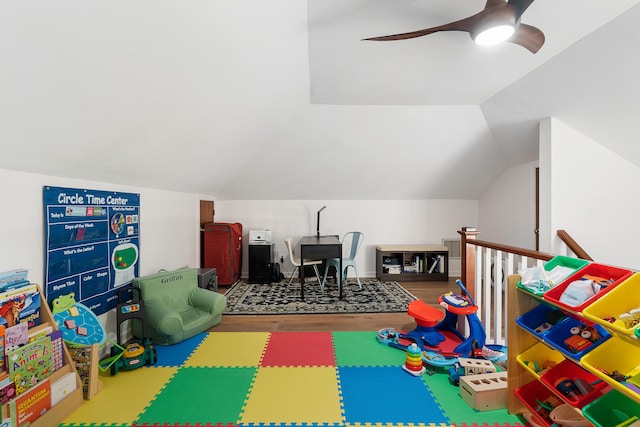 playroom with lofted ceiling, hardwood / wood-style floors, and ceiling fan