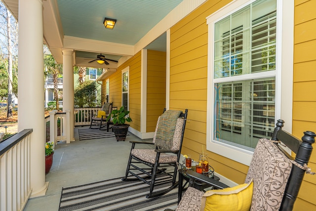 balcony featuring a porch and ceiling fan