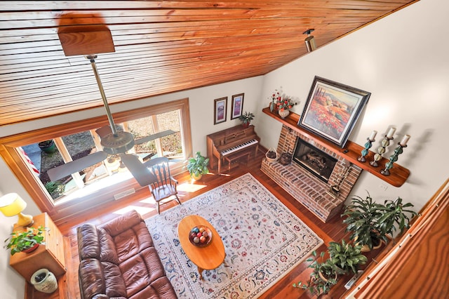 living room with wood ceiling, a fireplace, and hardwood / wood-style flooring