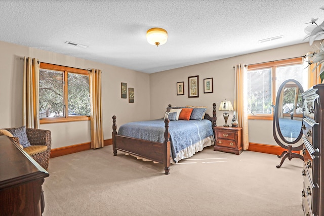 carpeted bedroom with a textured ceiling