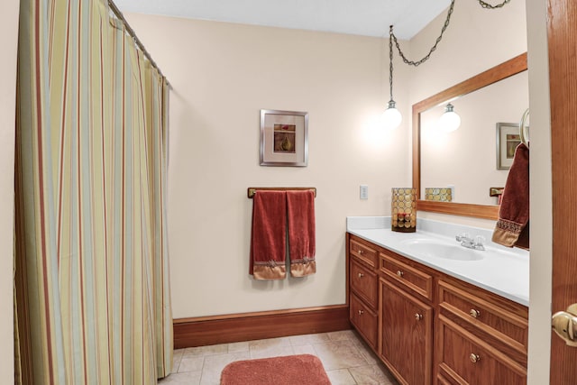 bathroom featuring vanity, tile patterned floors, and a shower with shower curtain