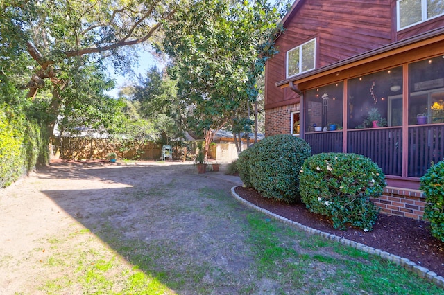 view of yard featuring a sunroom