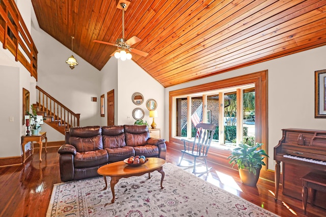 living room with dark hardwood / wood-style floors, ceiling fan, high vaulted ceiling, and wooden ceiling