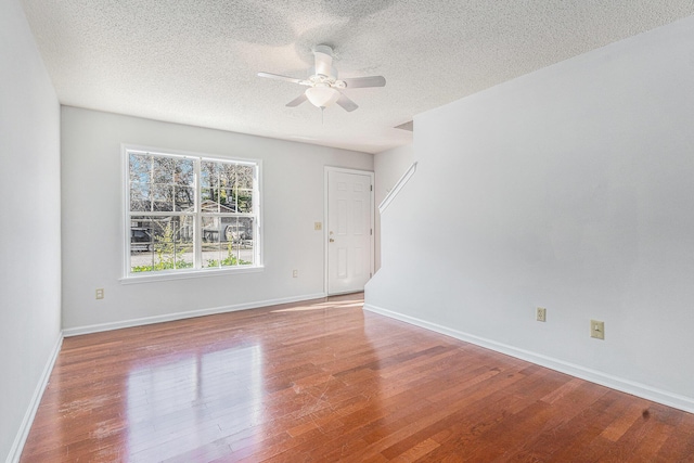 111 Elmwood Ave Unit A, Ladson, SC 29456 - empty room featuring a ceiling fan, wood finished floors, a textured ceiling, and baseboards