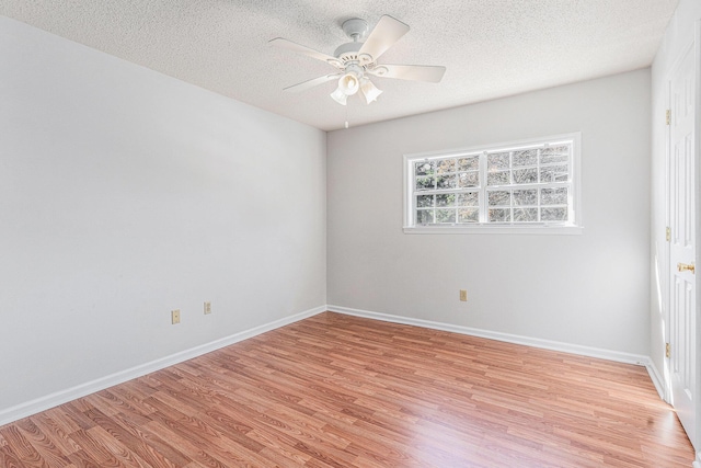 111 Elmwood Ave Unit A, Ladson, SC 29456 - unfurnished room featuring light wood-style floors, a textured ceiling, ceiling fan, and baseboards