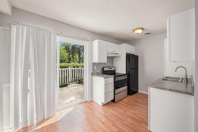 111 Elmwood Ave Unit A, Ladson, SC 29456 - kitchen featuring electric range, a sink, freestanding refrigerator, under cabinet range hood, and light wood-type flooring