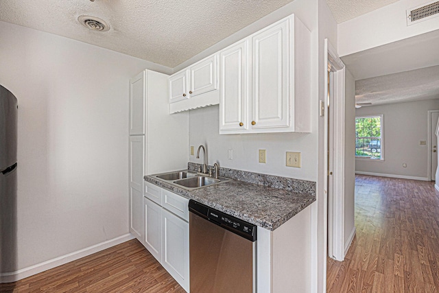 111 Elmwood Ave Unit A, Ladson, SC 29456 - kitchen featuring stainless steel dishwasher, a sink, wood finished floors, white cabinets, and a textured ceiling